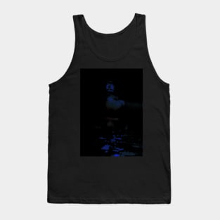 Portrait, digital collage and special processing. Man in dark corner, looking. Blue, glowing eyes. Tank Top